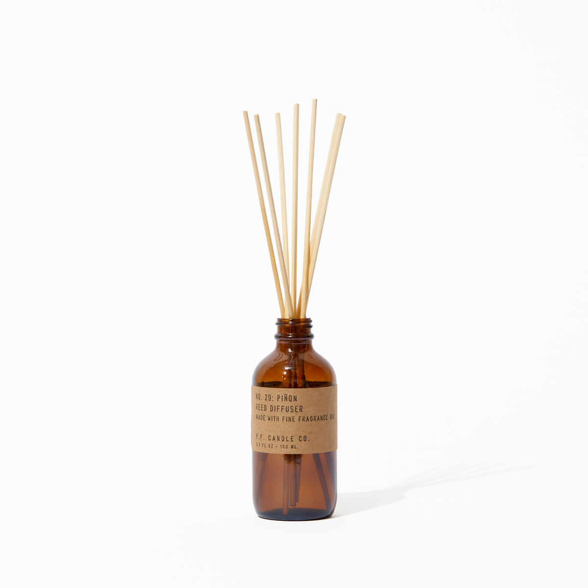P.F. Candle Co. Piñon Reed Diffuser - Product - Our Reed Diffusers come in apothecary-inspired amber glass bottles with our signature kraft label and rattan reeds. Low-maintenance scent throw, all day long - no match necessary. 