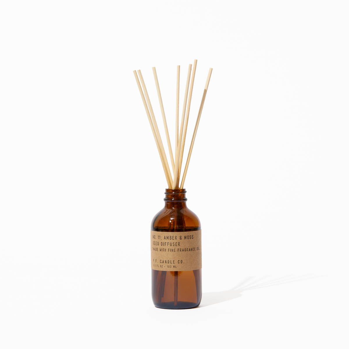 P.F. Candle Co. Amber & Moss Reed Diffuser - Product - Apothecary-inspired amber glass bottles with our signature kraft label and rattan reeds. Low-maintenance scent throw, all day long - no match necessary.