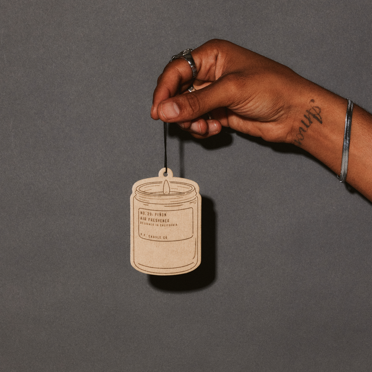pinon air freshener with hand