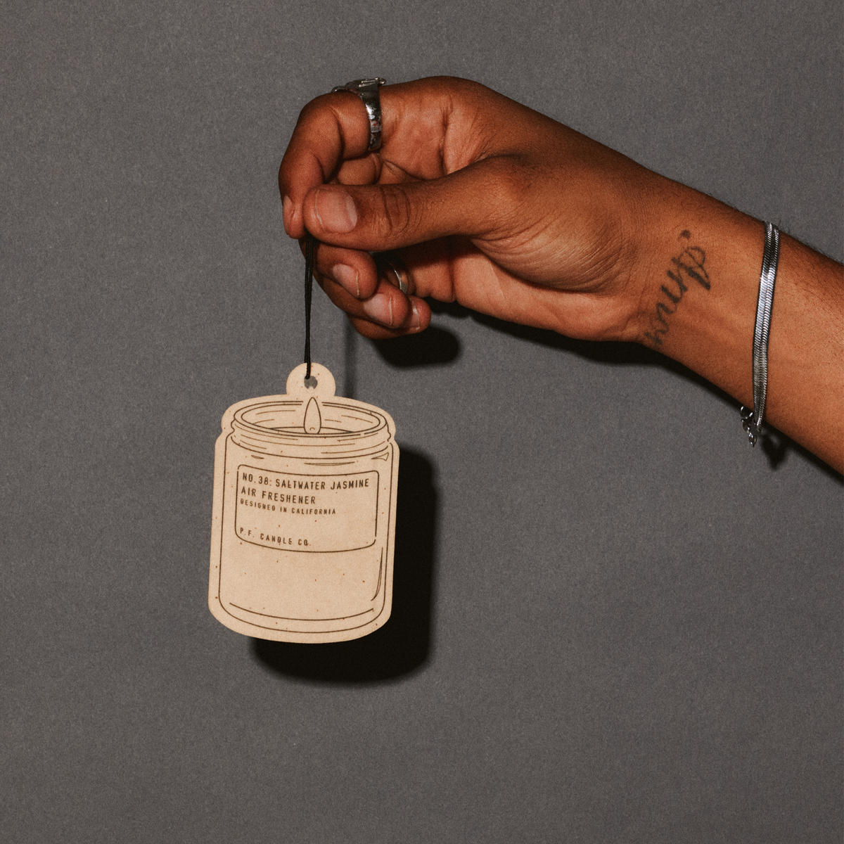saltwater jasmine air freshener with hand
