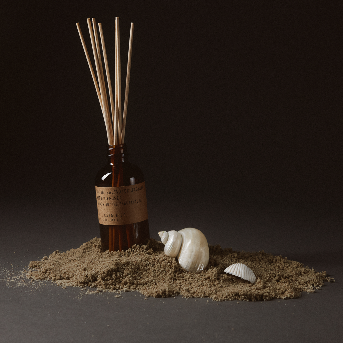 saltwater jasmine reed diffuser on sand