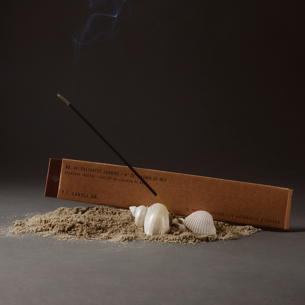saltwater jasmine incense sticks on sand