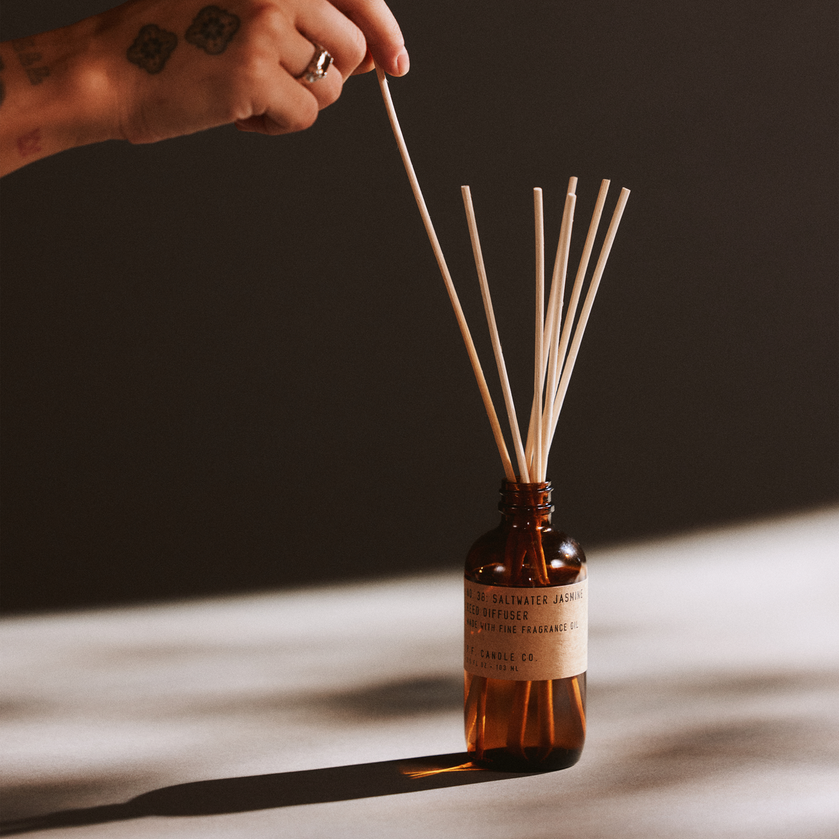 saltwater jasmine reed diffuser with hand